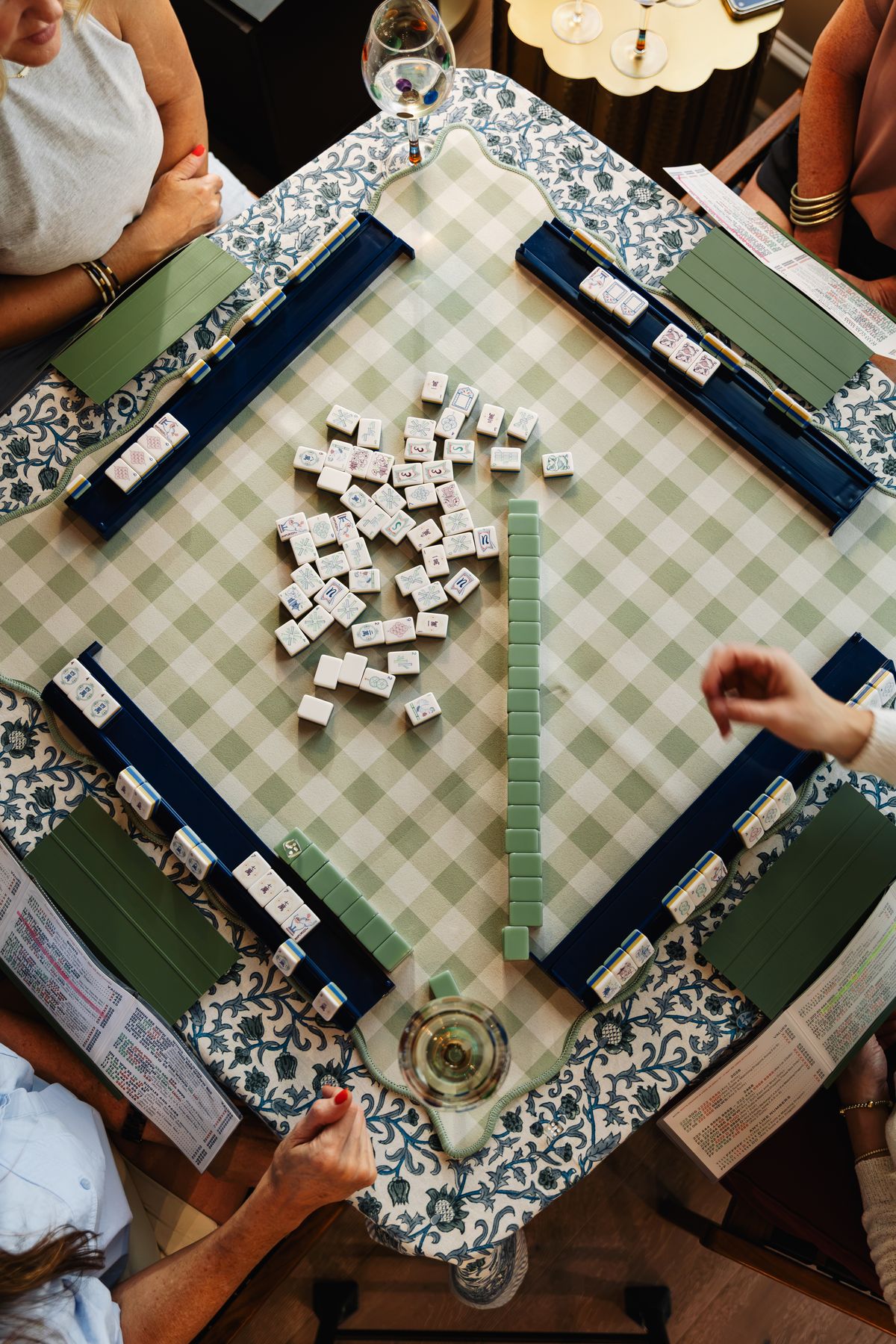 Gingham mahjong mat, racks and tiles from above